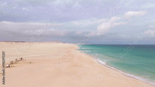 Aerial view of Morro de Areia Natural Reserve and Praia de Chaves,green ocean,sandy beach,desert dunes and luxury resort,Boa Vista,Cape Verde.