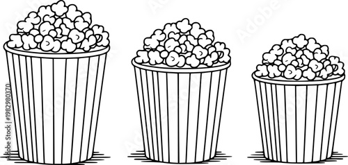 Striped popcorn buckets filled with popcorn, isolated white background, snack food