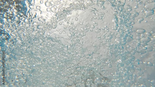 Underwater background sea in stream with bubbles. Clean pure blue water flow in motion. Lake river ocean. Travel summer