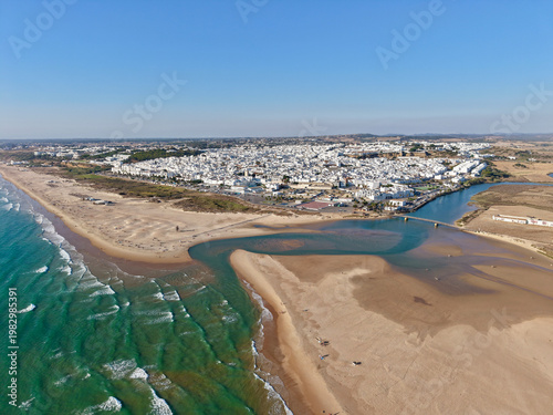 Aerial view of Conil de la Frontera with the beautiful beaches of the Costa de la Luz on the Atlantic coast at the mouth of the Rio Salado river. Andalusia, Costa de la Luz, Spain