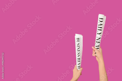 Woman with rolled newspaper...