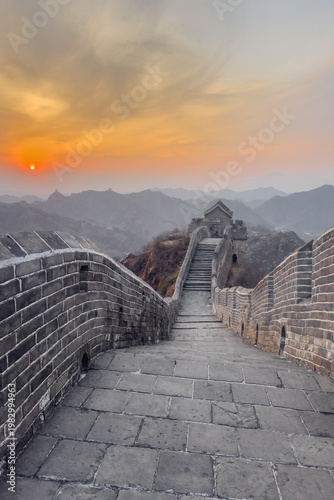 Vertical view the Great Wall of China at sunset.