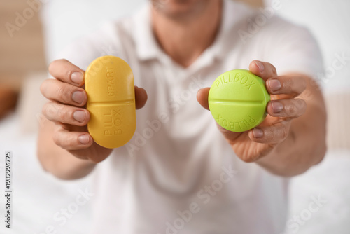 Middle-aged man holding dif...