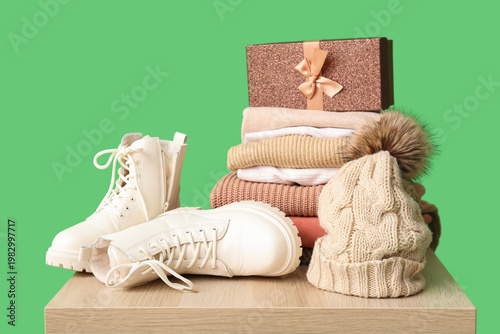 Stacked sweaters with hat, ...