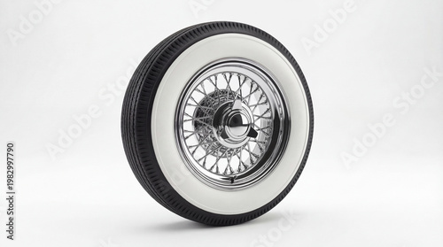 vintage car tire with whitewall and shiny chrome wire spoke hubcap isolated on white background. classic automotive restoration part. copyspace, banner, website header.
