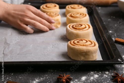 Woman preparing cinnamon ro...