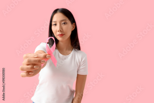 Young Asian woman with pink...