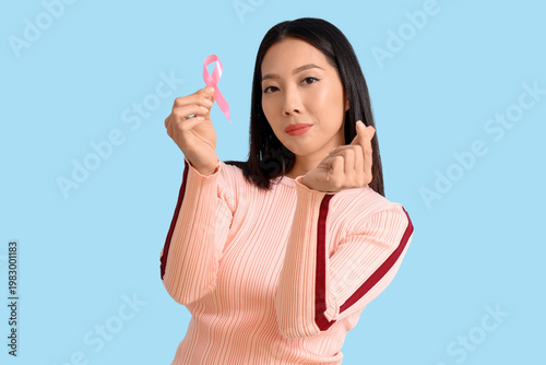 Young Asian woman with pink...