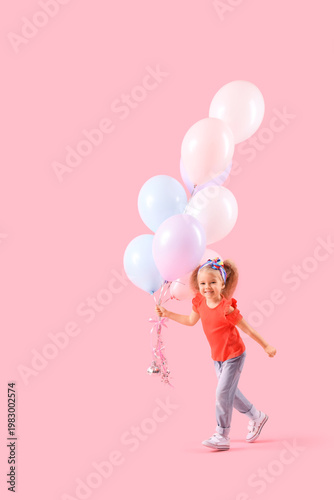 Cute little girl with beautiful balloons on pink background