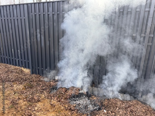 FIRE on the site. the smoke when burning the dry leaves in spring