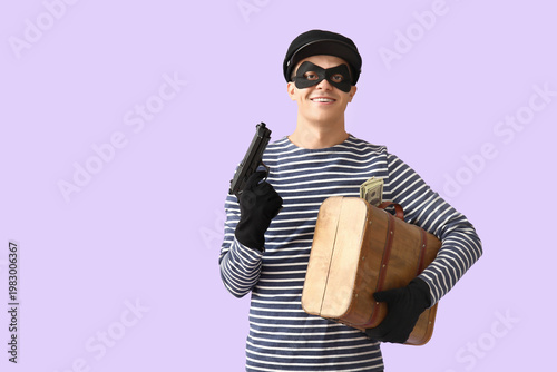 Male thief with briefcase o...