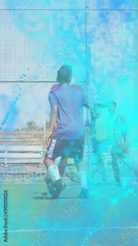 Vertical video: Soccer defender marking near goal during cross from right blue overlay obscuring