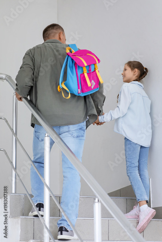 Father walking his little d...