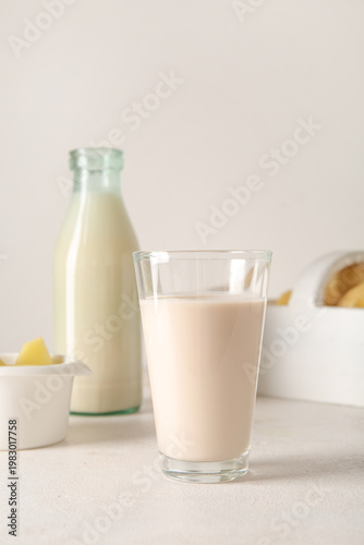 Glass of tasty potato milk ...