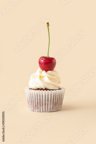Tasty cherry cupcake on bei...