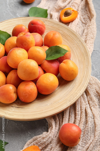 Plate with fresh apricots o...