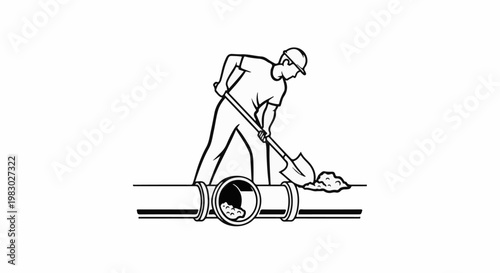 Worker with shovel clearing debris from a pipe
