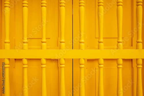 Yellow Wooden Door Symmetrical Pattern Close View