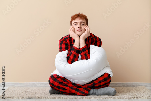 Young man with soft pillow ...