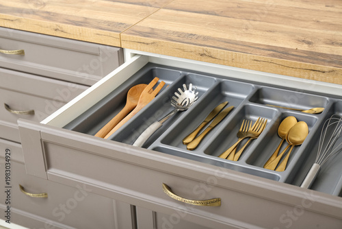 Open kitchen drawer with di...