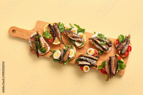 Wooden board of tasty sandw...