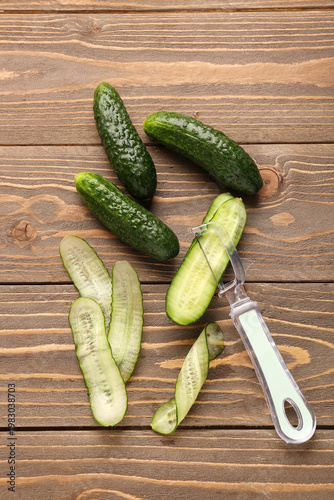 Fresh cucumbers and cut sli...