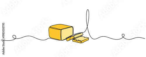 Butter block being sliced with knife on white background