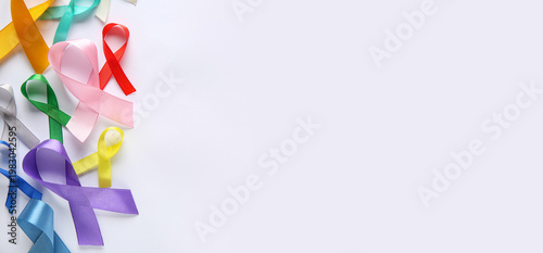 Colorful ribbons on white b...