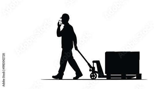 A dark silhouette of a worker pushing a hand truck loaded with a large box while talking on a phone silhouette high quality professional