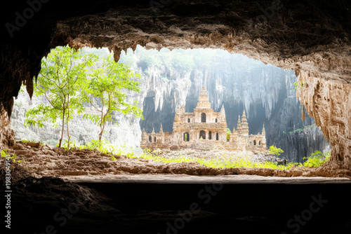 Breathtaking view of underground city, featuring ancient architecture surrounded by natural rock formations and lush greenery. serene atmosphere