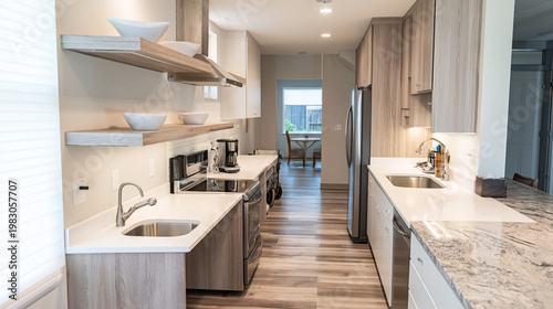 Kitchen features marble countertops and wooden shelving with a stainless steel refrigerator in a contemporary home interior designed with a focus on functionality and style.