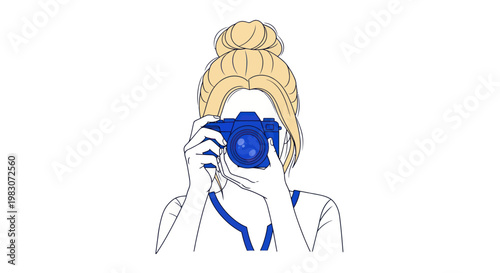 Woman holding a digital camera.