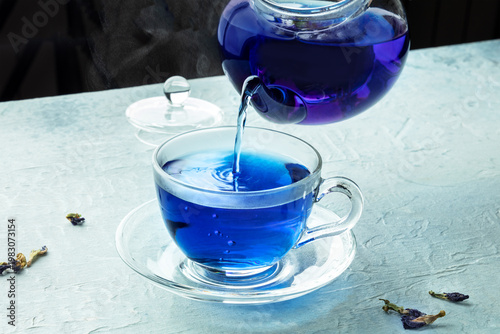 Blue tea, an infusion of butterfly pea flowers, poured into a cup