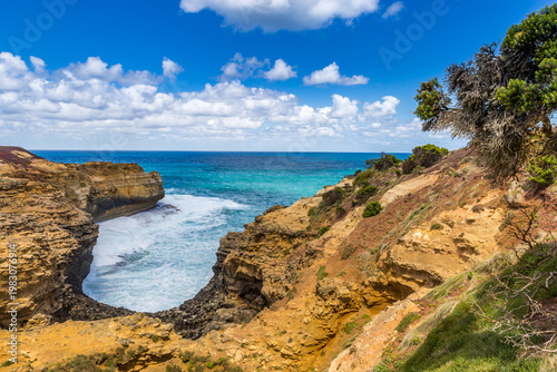Natural archway and rock formation The Grotto showcase the vibrant coastline, with clear waters and rugged cliffs, perfect for exploring the beauty of Australia's landscape