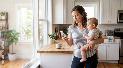 Mother holding baby on hip while standing in kitchen
