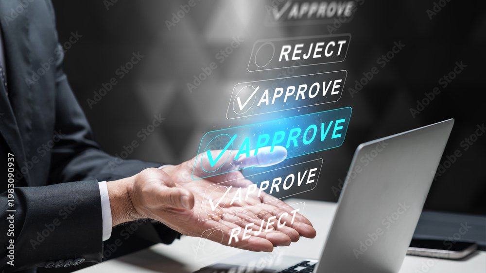 Obraz premium A businessman in a suit uses a futuristic digital interface to approve and reject applications or documents on a laptop, illustrating efficient decision making and workflow automation