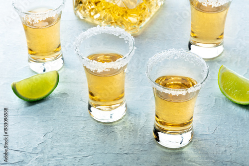 Wallpaper Mural Tequila shots with salted rims and lime slices, with a decanter, on a slate background Torontodigital.ca