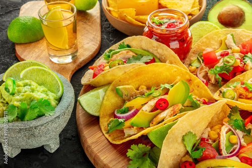 Wallpaper Mural Mexican food. Tacos, tequila, guacamole, nachos, a close-up on a black background Torontodigital.ca
