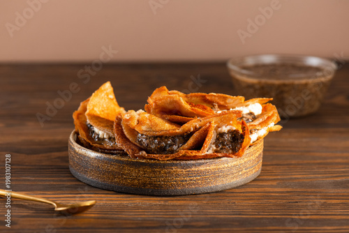 Gluten free pancakes with vegan chia caviar on a wooden table. Healthy dairy free plant based breakfast.