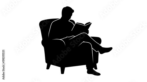 Man sitting in armchair reading book.