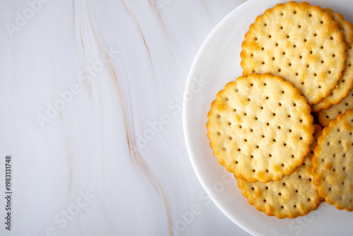 Round Savory Crackers on a White Plate