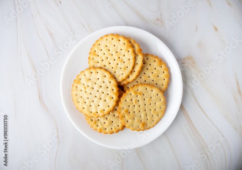 Round Savory Crackers on a White Plate