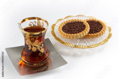 a cup of tea and some snack biscuits