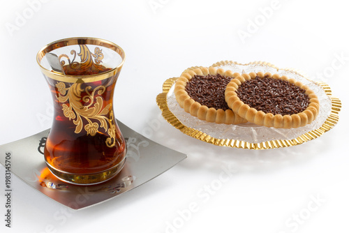 a cup of tea and some snack biscuits