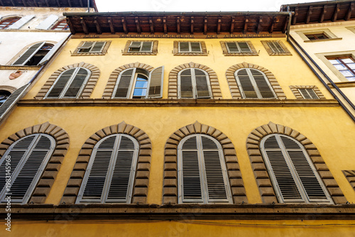 Facade of an old Renaissance apartment building in the historic center of Florence, Tuscany, Italy, Europe