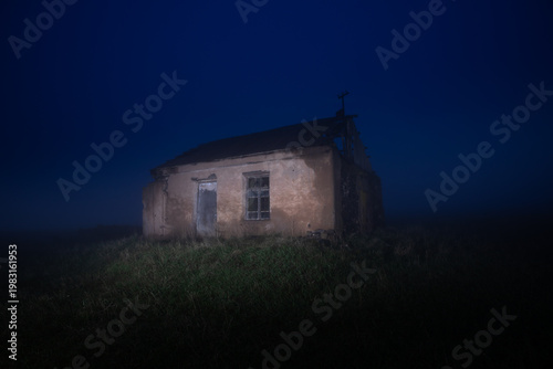 Картината върху платно Abandoned house under cloudy twilight sky, moody atmosphere with soft fading light, evoking solitude, mystery, and quiet desolation in a rural landscape setting