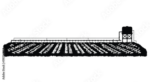 Rural agricultural landscape with farm fields and water tower in countryside setting during daytime with natural light and serene peaceful atmosphere