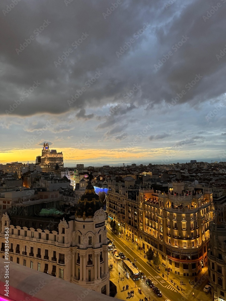 Fototapeta premium Madrid skyline at sunset with dramatic clouds and city view