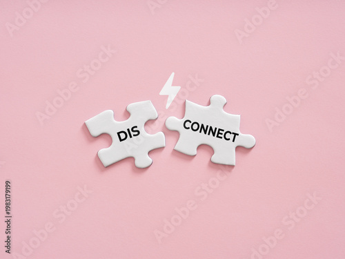 Disconnecting puzzle pieces symbolizing relationship breakup and conflict