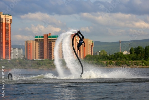 Flyboarding is an extreme water sport and entertainment that allows a person to float in the air above the water using a powerful water flow.